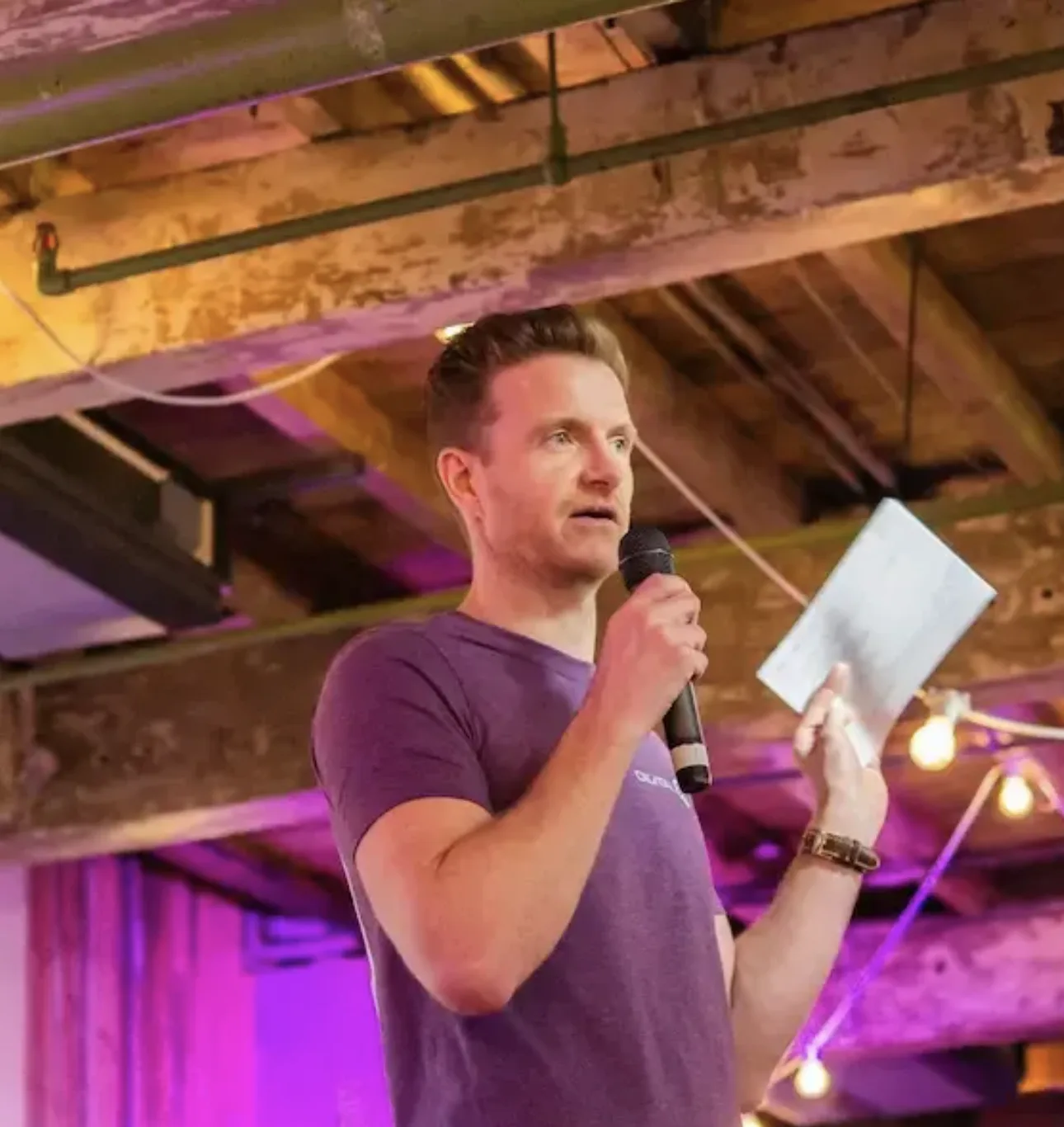 Mark Byrne on stage, talking about the power of Claude